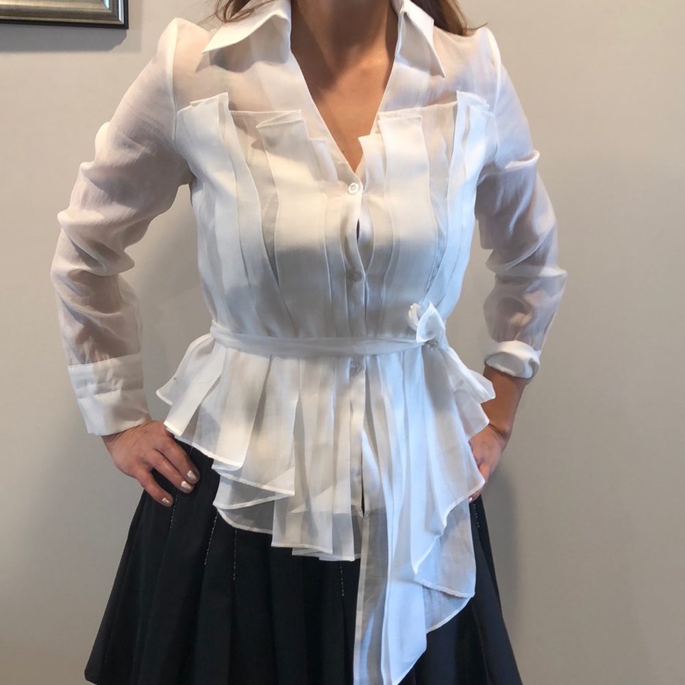 White fancy blouse with high and low length.